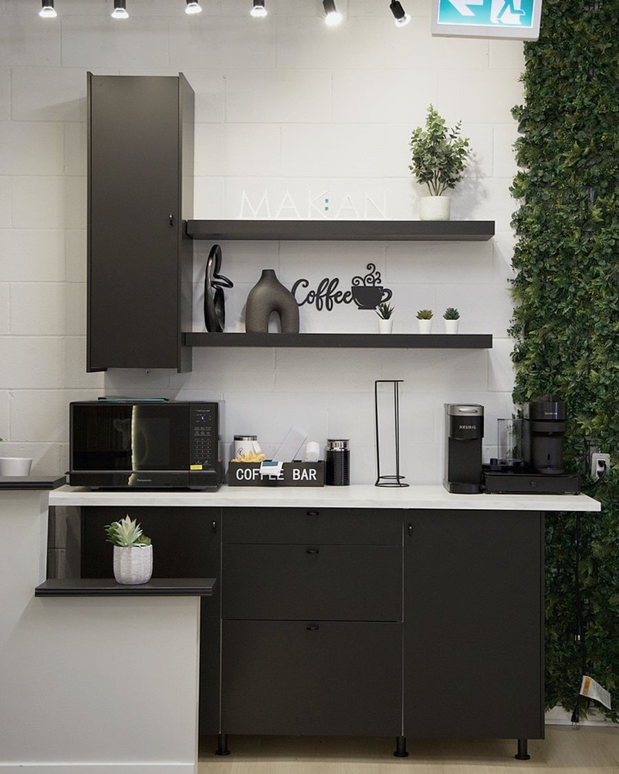 Office coffee bar with a green wall